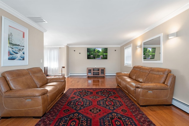 living room with baseboard heating, light hardwood / wood-style flooring, and ornamental molding