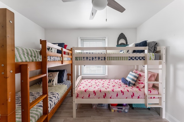 bedroom with ceiling fan and wood finished floors