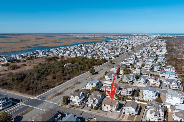 birds eye view of property featuring a residential view and a water view