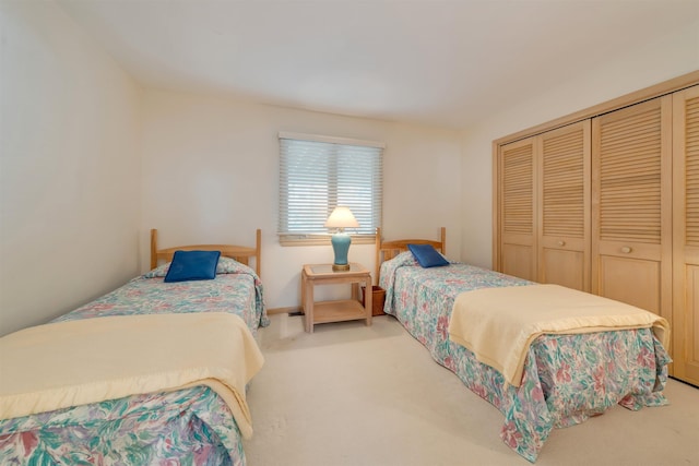 carpeted bedroom with a closet