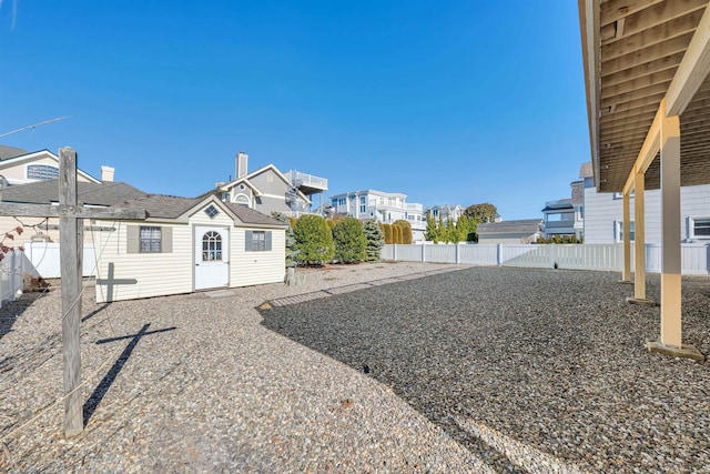 view of yard with a residential view and fence