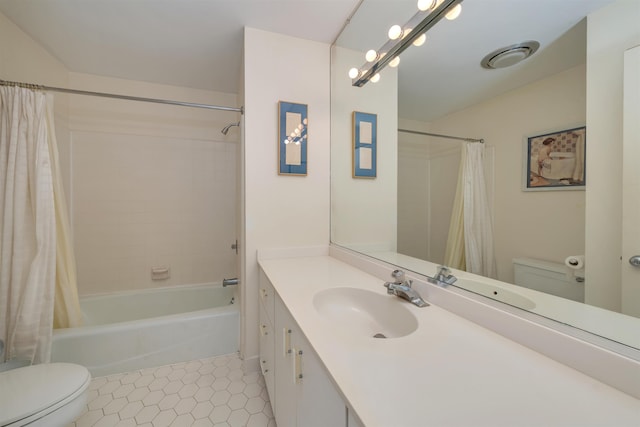 bathroom with tile patterned floors, vanity, toilet, and shower / tub combo with curtain