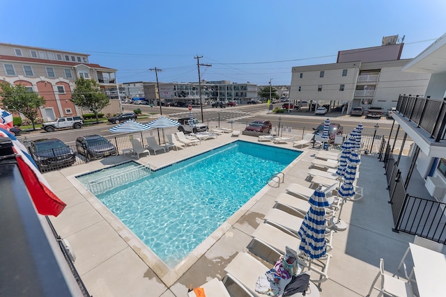 view of swimming pool with a patio