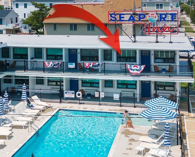 view of swimming pool with a patio area