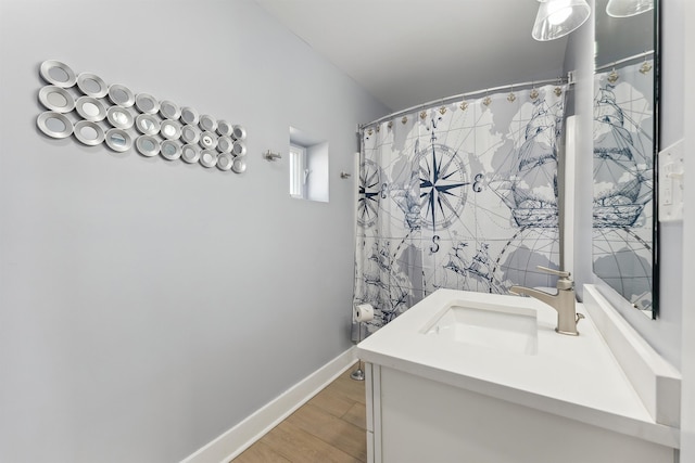 bathroom featuring vanity and wood-type flooring