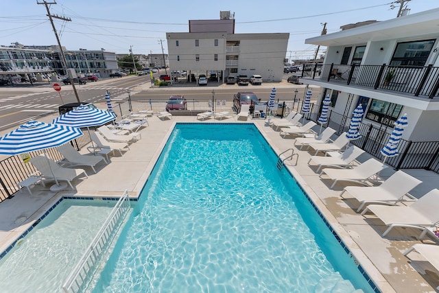 view of swimming pool with a patio