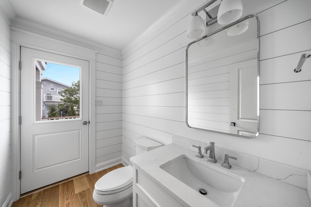 65 E 24th St, Avalon, NJ 08202 - bathroom with vanity, wood finished floors, wood walls, and crown molding