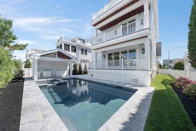 65 E 24th St, Avalon, NJ 08202 - back of property featuring a pool with connected hot tub and a patio area