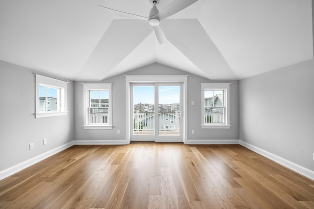 65 E 24th St, Avalon, NJ 08202 - unfurnished living room with plenty of natural light, ceiling fan, vaulted ceiling, and wood finished floors