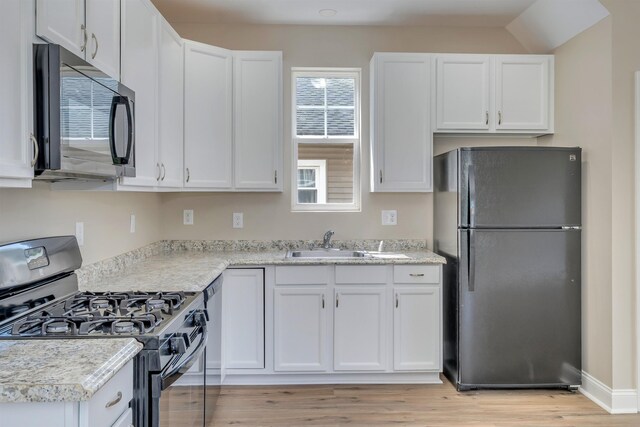 14 E New York Ave, Villas, NJ 08251 - kitchen featuring black appliances, white cabinetry, and light wood finished floors