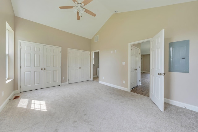 14 E New York Ave, Villas, NJ 08251 - unfurnished bedroom with electric panel, multiple closets, high vaulted ceiling, carpet, and a ceiling fan