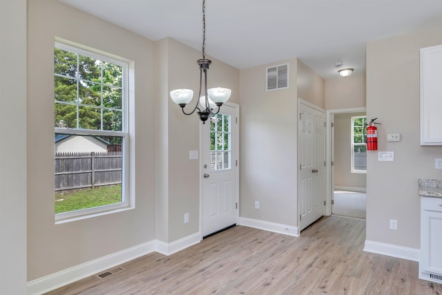 14 E New York Ave, Villas, NJ 08251 - foyer featuring a chandelier, light wood-type flooring, and healthy amount of natural light