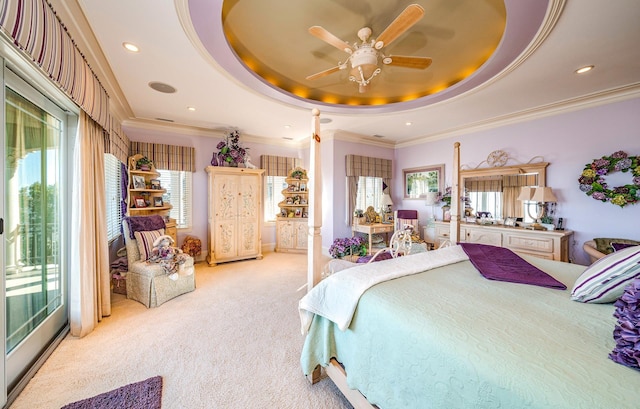 bedroom featuring light carpet, access to exterior, a tray ceiling, and crown molding