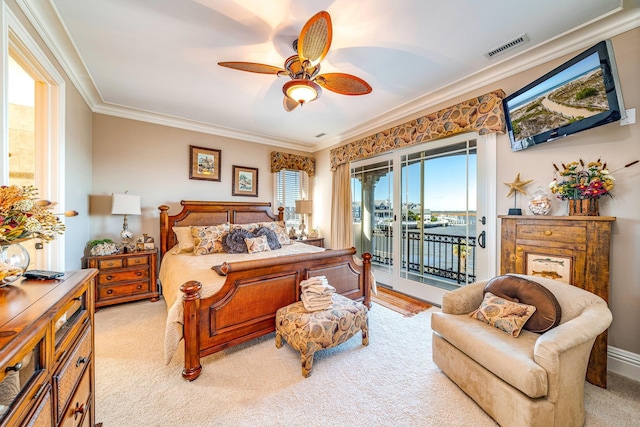 bedroom with ceiling fan, ornamental molding, light carpet, and access to outside