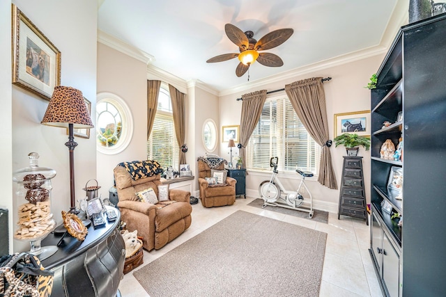 living area with ceiling fan, light tile patterned flooring, and ornamental molding