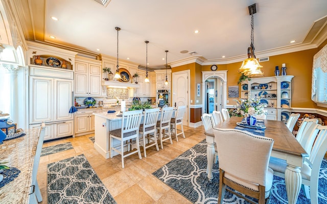 dining space featuring ornamental molding