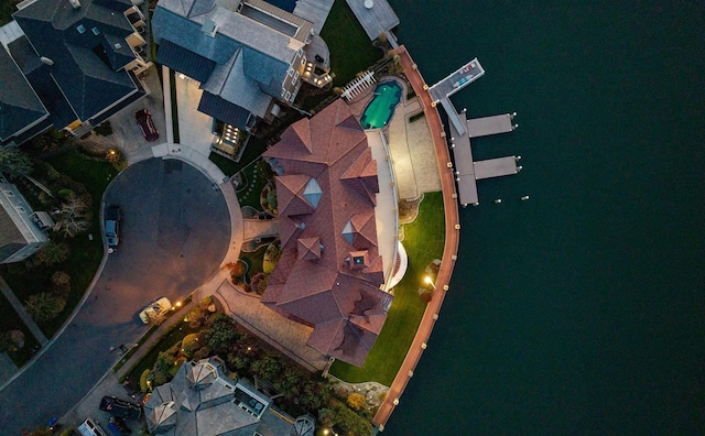 birds eye view of property with a water view