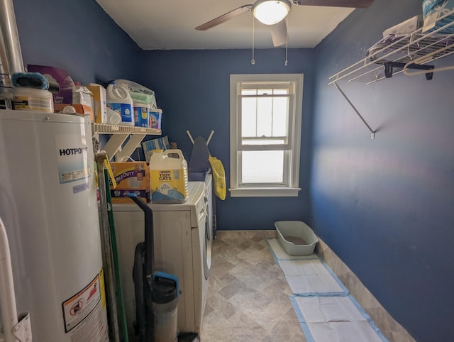 washroom featuring laundry area, gas water heater, a ceiling fan, and separate washer and dryer