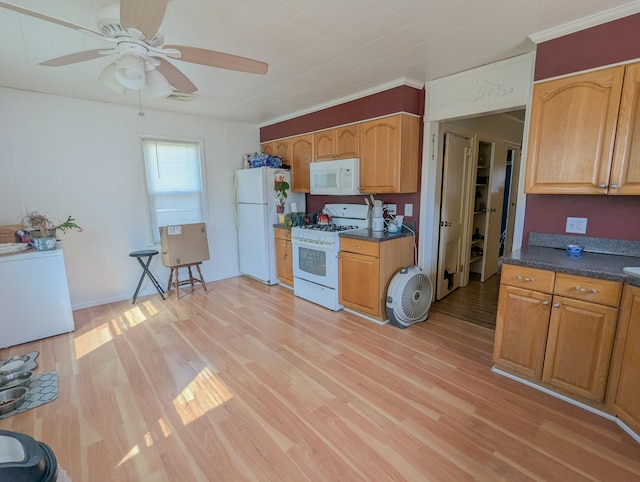 kitchen with visible vents, white appliances, light wood-style floors, and dark countertops