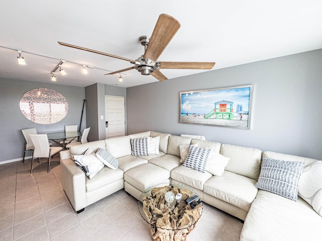 tiled living room with ceiling fan