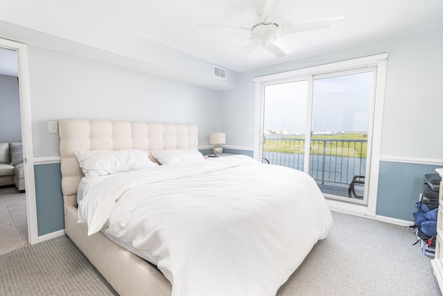 bedroom with ceiling fan, light carpet, and access to outside