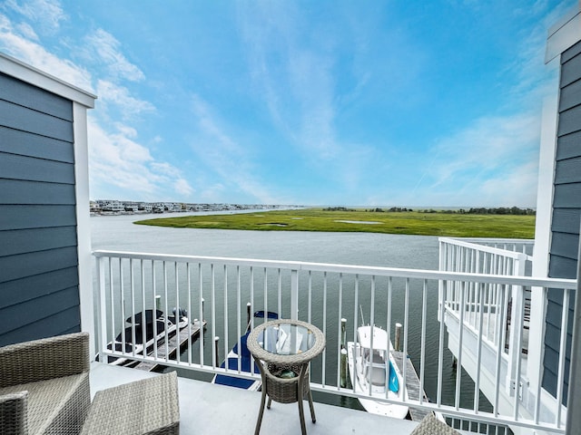 balcony featuring a water view