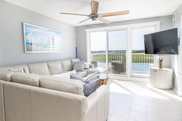 living room with light tile patterned floors and ceiling fan