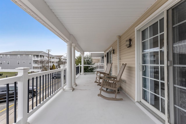 balcony with a porch and a residential view