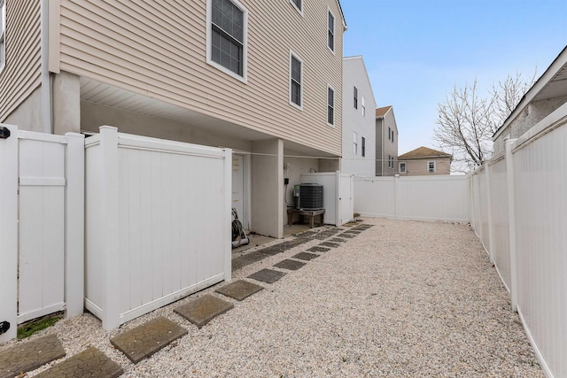 view of yard with a patio area, cooling unit, and a fenced backyard