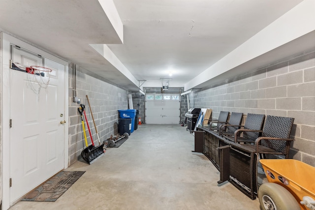 garage featuring concrete block wall