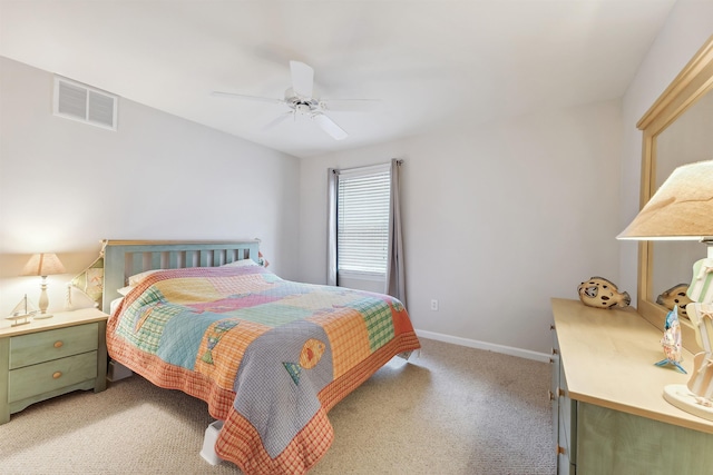 bedroom with baseboards, a ceiling fan, visible vents, and light colored carpet