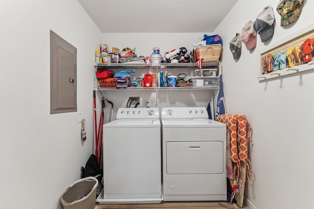 laundry room featuring laundry area, separate washer and dryer, and electric panel