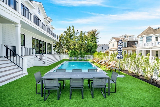 10017 Corinthian Dr, Stone Harbor, NJ 08247 - view of swimming pool with a residential view, a yard, a fenced backyard, a fenced in pool, and outdoor dining area