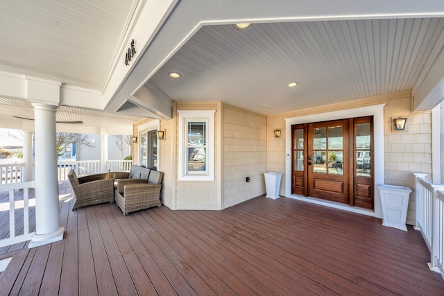 deck with a porch and outdoor lounge area