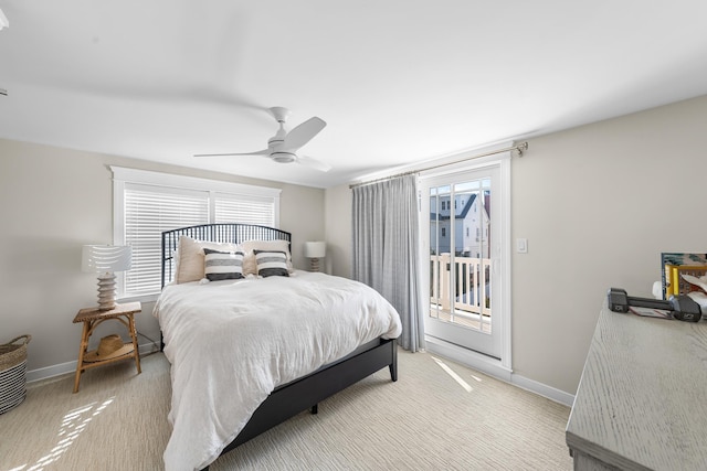 bedroom featuring access to outside, baseboards, a ceiling fan, and light colored carpet