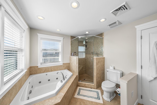 bathroom with visible vents, toilet, a stall shower, tile patterned flooring, and a whirlpool tub