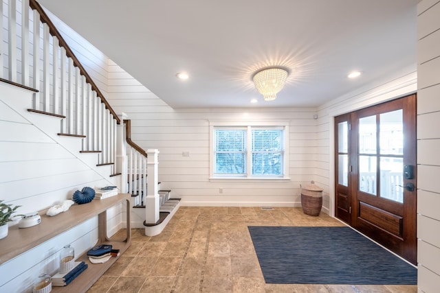 foyer entrance featuring stairs and recessed lighting