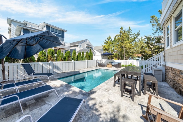 view of pool featuring a patio, a fenced backyard, outdoor dining area, and an outdoor hangout area