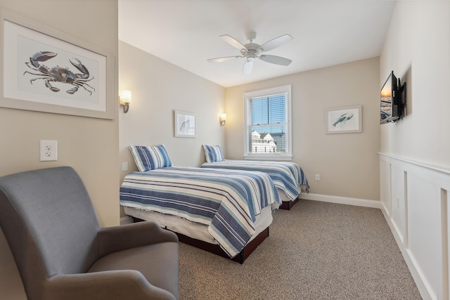 bedroom featuring a ceiling fan, carpet flooring, and baseboards