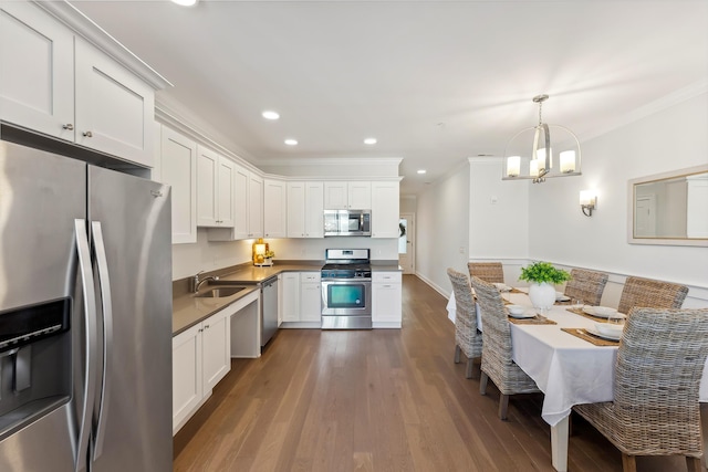 kitchen featuring appliances with stainless steel finishes, white cabinetry, and dark wood finished floors