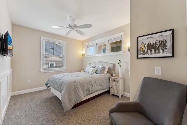 carpeted bedroom with baseboards and a ceiling fan