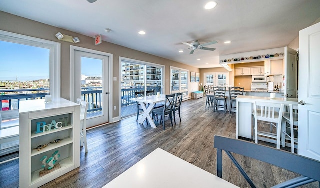 dining room featuring recessed lighting, dark wood-style flooring, ceiling fan, and baseboards