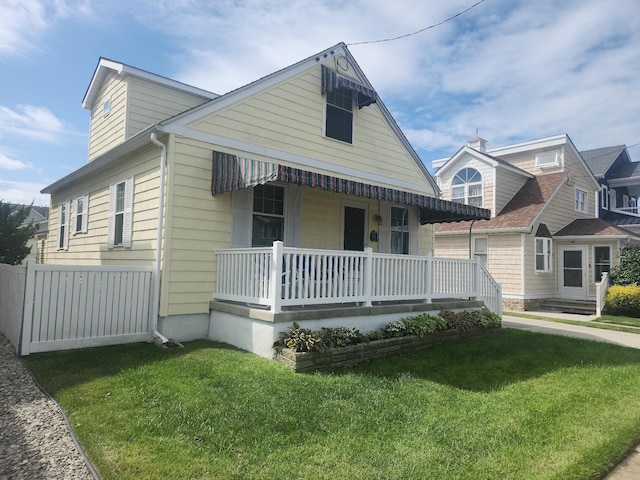 view of front facade with a porch and a front lawn