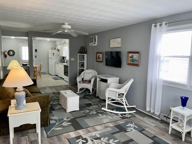 84018403 New Jersey Ave, Wildwood Crest, NJ 08260 - living room with hardwood / wood-style flooring, ceiling fan, and a wall unit AC