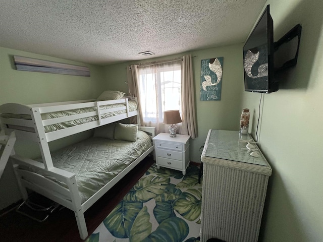 bedroom featuring a textured ceiling