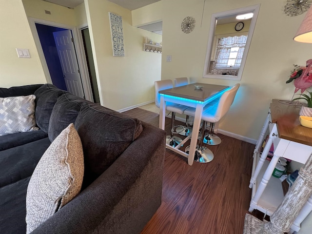 dining area with dark hardwood / wood-style flooring