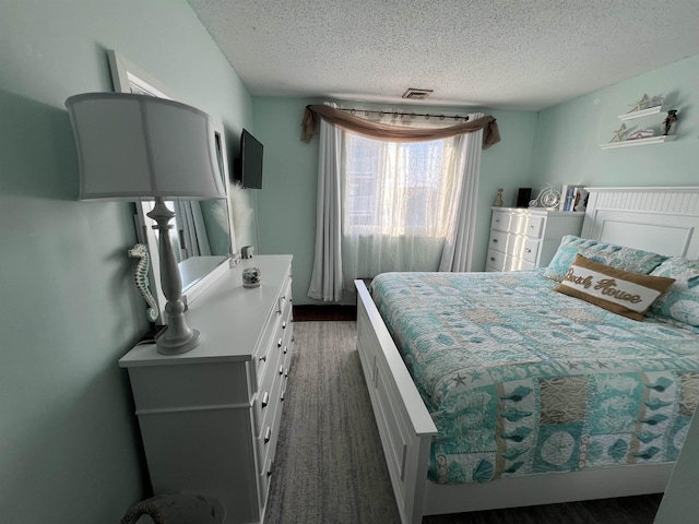 bedroom featuring a textured ceiling