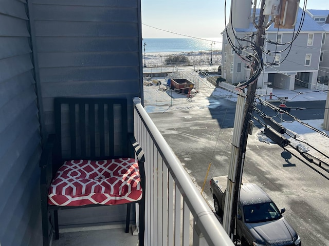 balcony featuring a water view