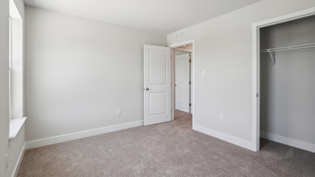 845 Broadway Unit 1, West Cape May, NJ 08204 - unfurnished bedroom featuring carpet flooring, a closet, and baseboards