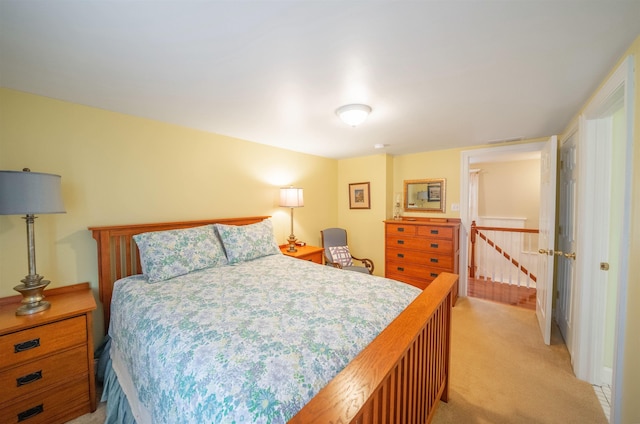 bedroom with light colored carpet